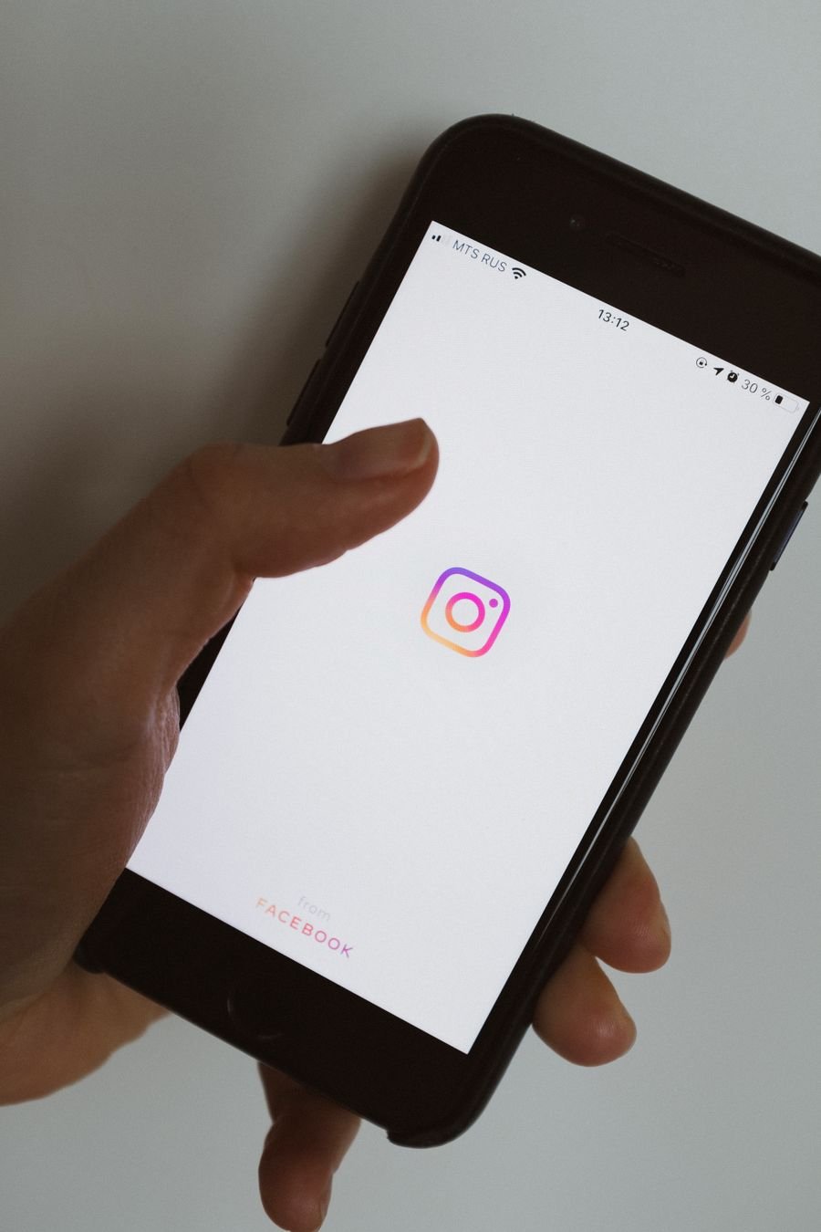 Person browsing a social media feed on a smartphone